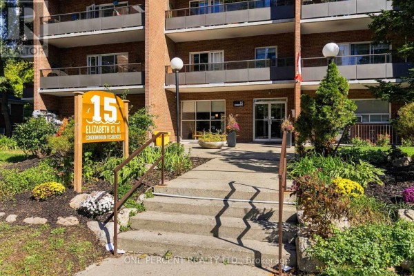 Concrete walkway leading to the entrance of 15 Elizabeth Street N condominium residence. - 904 - 15 Elizabeth Street N, Mississauga