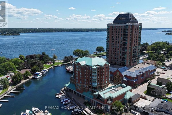 Aerial view of Tall Ships Landing buildings on a waterfront with boats and a river. - 904 - 15 St Andrew Street, Brockville