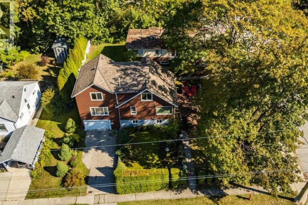 Aerial view of a residential house with a large tree in the front yard. - 904 Fifth Street, Nelson