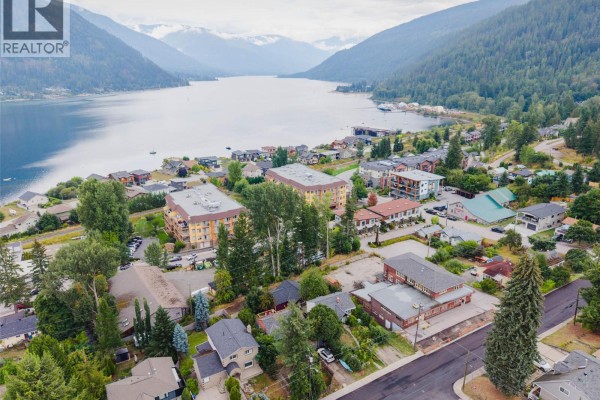 Aerial view of Nelson, BC, showing the commercial building and the lake in the background. - 905-909 Gordon Street, Nelson