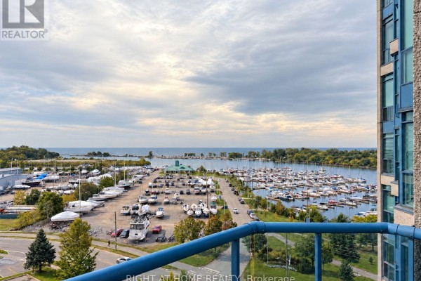 View from balcony of a marina filled with boats under a cloudy sky. - 906 - 340 Watson Street W, Whitby