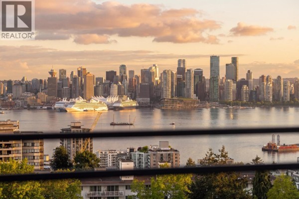 Panoramic view of Vancouver skyline and waterfront from apartment windows. - 906 112 E 13th Street, North Vancouver