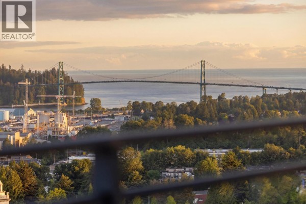 View of the Lions Gate Bridge and surrounding green landscape. - 906 112 E 13th Street, North Vancouver