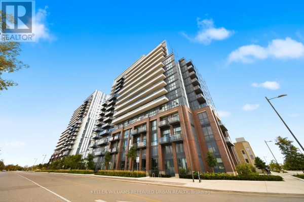 Low angle exterior view of a modern condo building with balconies and brick accents. - 907 - 10 Honeycrisp Crescent, Vaughan
