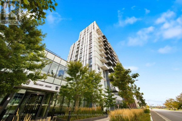 Close-up exterior view of a condo building's entrance and balconies, surrounded by trees. - 907 - 10 Honeycrisp Crescent, Vaughan