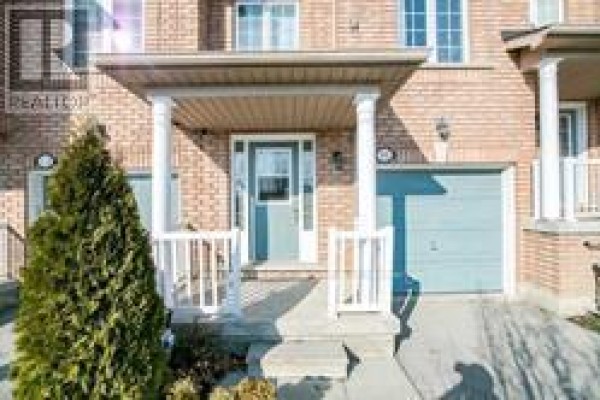 Front entrance porch with white railings, columns, and a light blue door. - 91 - 6399 Spinnaker Circle, Mississauga