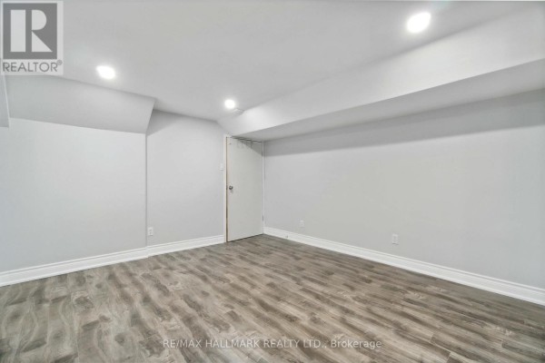 Basement kitchenette with white cabinets, oven, dishwasher, and microwave. - 91 Boston (lower) Crescent, Hamilton