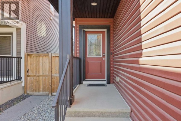 Room with a treadmill, white tiled floor, and decorative cabinet. - 91 Evansfield Rise Nw, Calgary