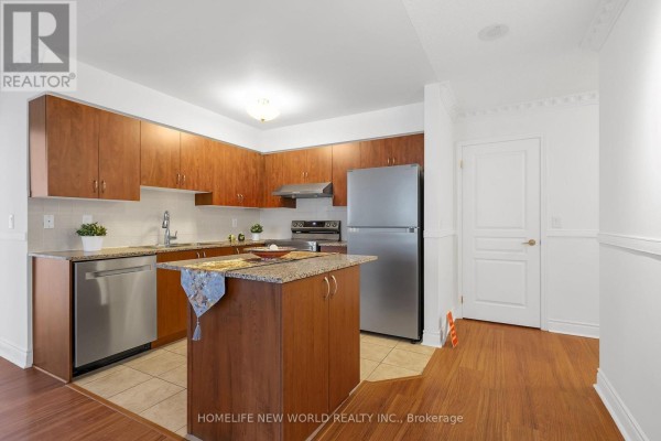 Kitchen with granite countertops, stainless steel appliances, wooden cabinets, and a central island. - 912 - 55 South Town Centre Boulevard, Markham