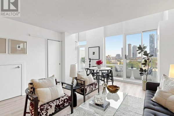 Living room with dining area and balcony overlooking Toronto. - 913 - 77 Lombard Street, Toronto
