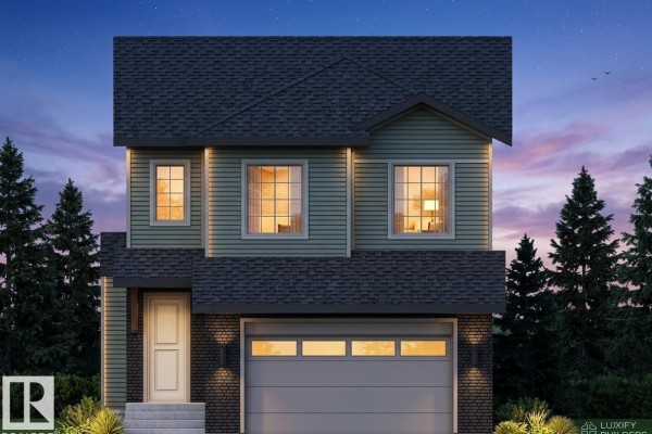 Front exterior of a two-story house with green siding, dark grey roof, and attached garage in daylight. - 9134 104 St, Morinville