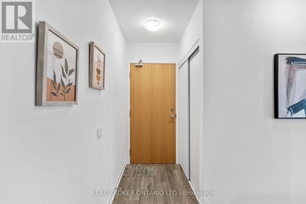 Apartment building gym with treadmills, elliptical machines, and stationary bikes. - 920 - 1787 St Clair Avenue W, Toronto