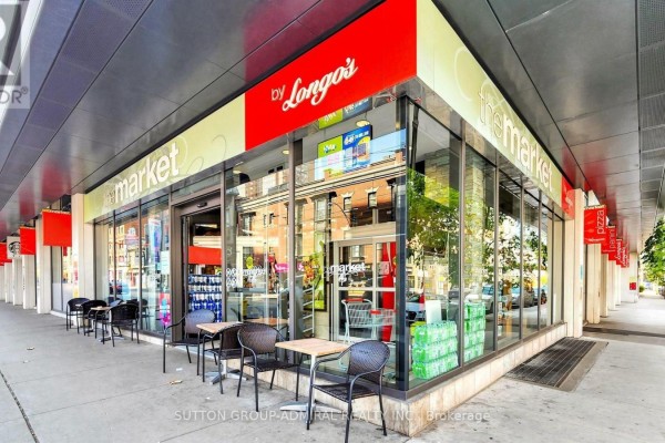 Street-level view of a Longo's grocery store with outdoor seating. - 922 - 111 Elizabeth Street, Toronto