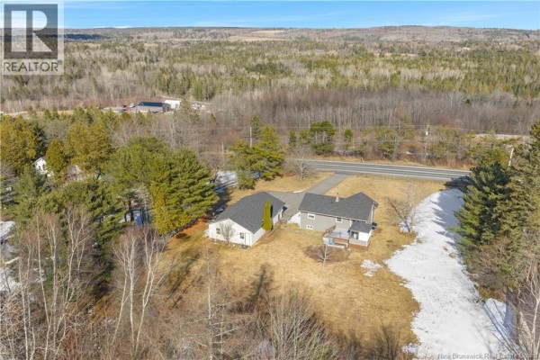 A wide view of the house and detached garage on a dry winter day. - 9250 Route 3, Old Ridge
