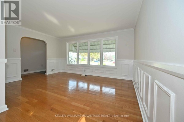 Kitchen with light oak cabinets, stainless steel appliances, and dark grey tiled floor. - 936 Somerville Street, Oshawa