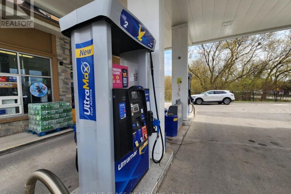 Close-up of an Ultramar gas pump with a car visible in the background. - 951 Dundas Street W, Whitby