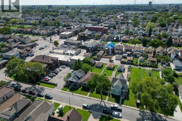 Aerial view of a residential neighborhood with houses and trees. - 969 Langlois, Windsor