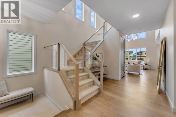 Main floor layout featuring living room, kitchen, and dining room areas. - 969 South Shore Terrace, Chestermere