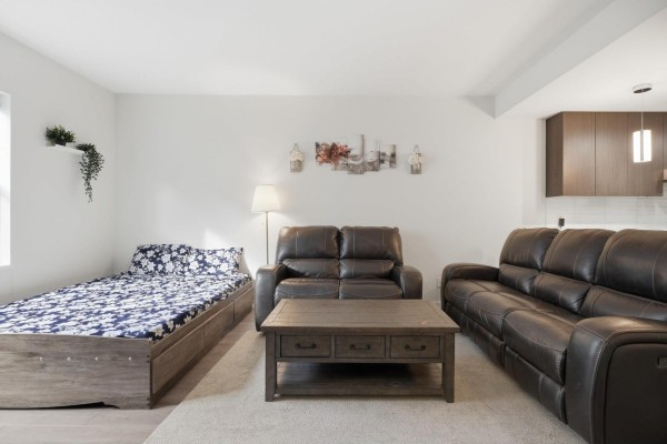Alternate angle of living room featuring floral bedding and modern decor - 97 32633 Simon Avenue, Abbotsford