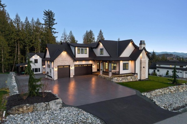 Empty room with carpet, large windows, and glass doors opening to a balcony with a view. - 9700 Gough Terrace, Mission