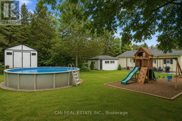 Yard with pool, playset, and sheds - 977 County Rd 38 Trent Hills