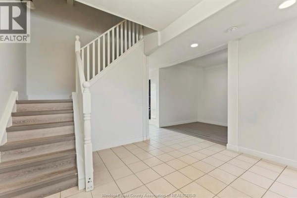 Another view of the porch featuring storage bins and bicycle - 977 Gladstone, Windsor