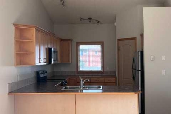 Living room/Dining room - A, 4813 49 Street W, Olds, AB T4H1E3 Photo 2