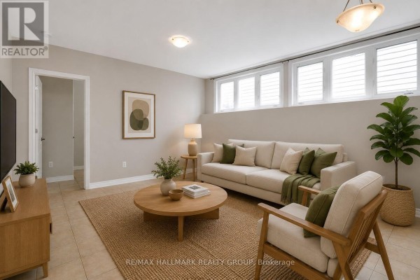 Kitchen area with light wood cabinets and white appliances, opening to a hallway with two doors. - A - 1170 South Russell Road, Russell