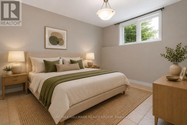 Living area with beige tile floors and a row of windows on the far wall. - A - 1170 South Russell Road, Russell