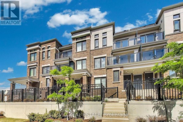 Close-up of townhouse entrance with modern design and glass railings - A - 14 Lookout Drive, Clarington