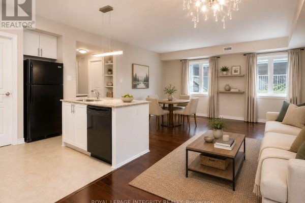 Open concept living space showing a kitchen island, dining area, and living room. - A - 20 Tadley Private, Ottawa