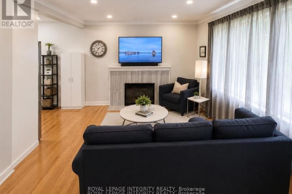 Bright white kitchen with stainless steel appliances, light wood floors, and subway tile backsplash. - A - 2748 Moncton Road, Ottawa