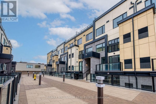 Overview of the community layout featuring low-rise buildings and a central courtyard. - A114 - 1650 Victoria Park Avenue, Toronto