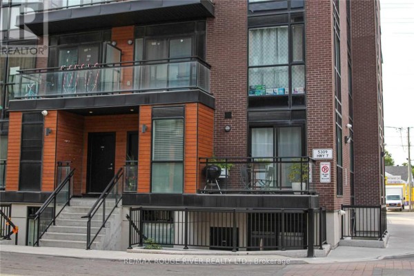 Townhouse exterior with brick facade, balconies, and street view. - A701 - 5309 Highway 7 Road, Vaughan