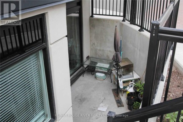 Kitchen with white cabinets, granite countertops, and stainless steel appliances. - A701 - 5309 Highway 7 Road, Vaughan