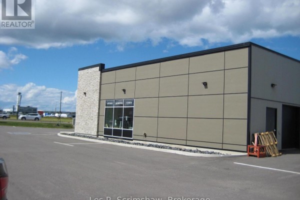 Retail space interior with partition walls, furniture displays, and artwork on walls. - B - 825 Fort William Road, Thunder Bay