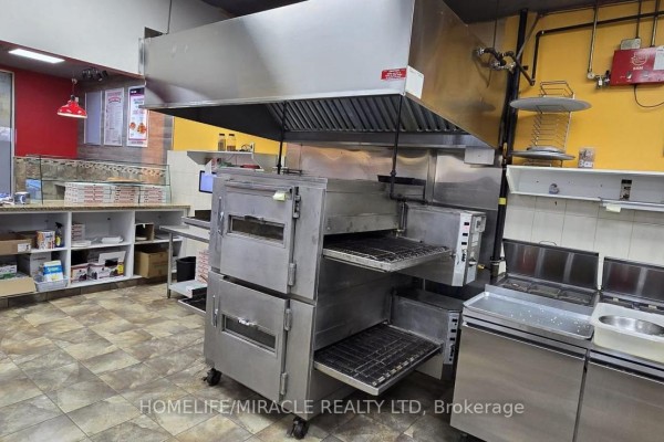 Commercial kitchen with ovens and ventilation hood - B-1 - 535 Saginaw Parkway, Cambridge
