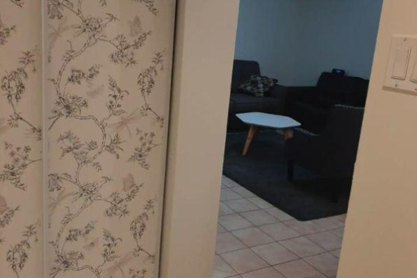 View of a floral patterned closet door from a hallway. - B2 - 34 Penhurst Avenue, Toronto