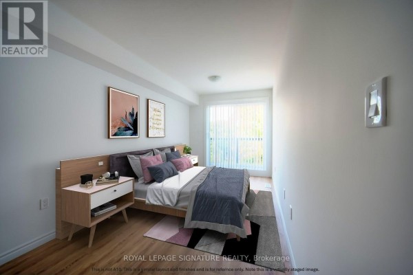Bedroom with a queen-size bed, wood nightstand, and a sliding glass door with vertical blinds. - B5 - 374 Prospect Avenue, Kitchener