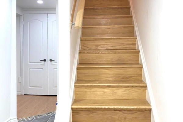 Wooden staircase leading to upper levels with a hallway on the left. - Basement - 120 Greenbelt Crescent, Richmond Hill