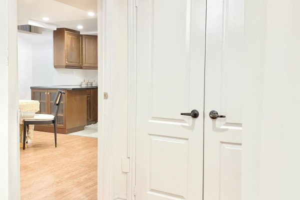 View of double doors leading to the kitchen area from the hallway. - Basement - 120 Greenbelt Crescent, Richmond Hill