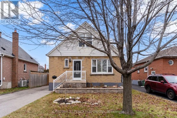 Front view of a light brown brick house with a front door and large window. - Basement - 144 Taylor Avenue, Hamilton