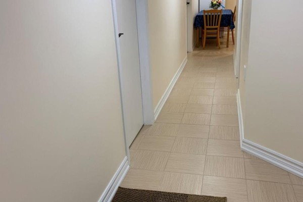 Corner of a room with a bed, a small table, and a heating unit on the wall. - Basement - 175 Mabley Crescent, Vaughan