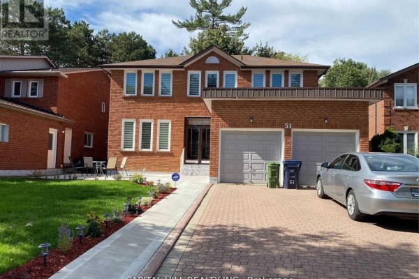 Exterior of a two-story brick house with a double garage and paved driveway. - Basement - 51 Glenthorne Drive, Toronto