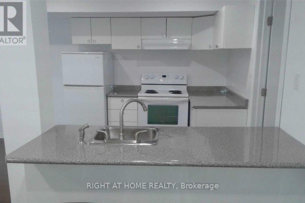 L-shaped kitchen with white cabinets, grey speckled countertops, and white appliances, viewed from a breakfast bar. - Bsmet - 75 Maffey Crescent, Richmond Hill