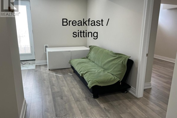 Breakfast area with a sofa and access to a small outdoor space - Bsmnt - 33 George Robinson Drive, Brampton