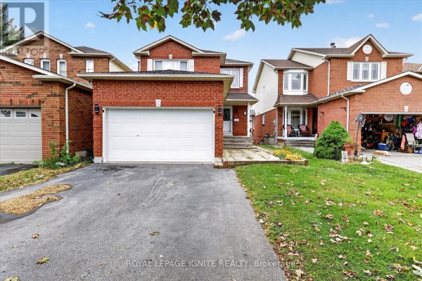 Front exterior view of a two-story brick house with a white garage door and walkway. - Bsmnt - 8 Vail Meadows Crescent, Clarington