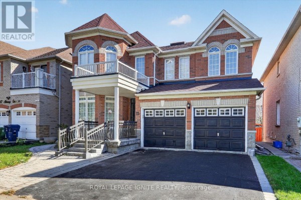 Front view of a red brick two-story house with a balcony and double garage doors. - Bsmt - 15 Starry Crescent, Toronto