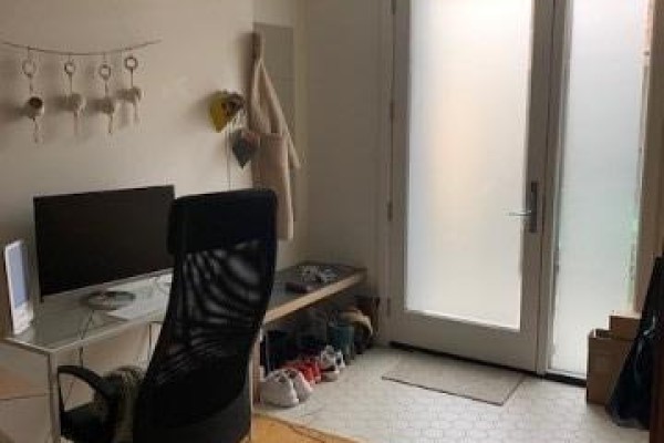 Home office area with desk, monitor, chair, and shoe storage bench. - Bsmt - 152 Close Avenue, Toronto