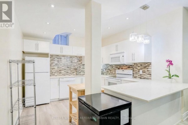 Bright kitchen with white cabinets, quartz countertops, and pendant lighting - Bsmt - 161 Vanda Drive, Vaughan